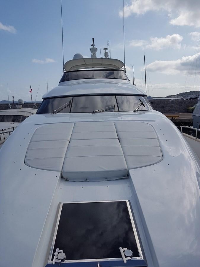 a white yacht in a harbor aboard GEMINI 3 Yacht for Sale