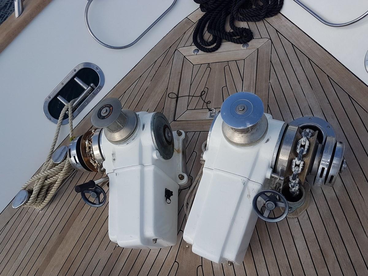 a white machine on a wooden surface aboard GEMINI 3 Yacht for Sale