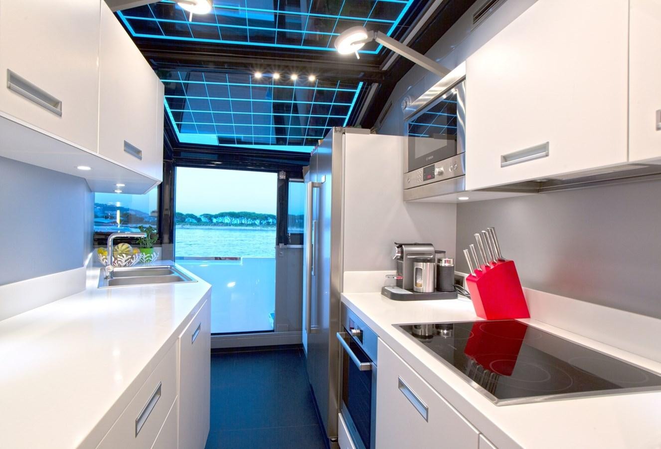 a kitchen with a sink and cabinets aboard PANGEA Yacht for Sale