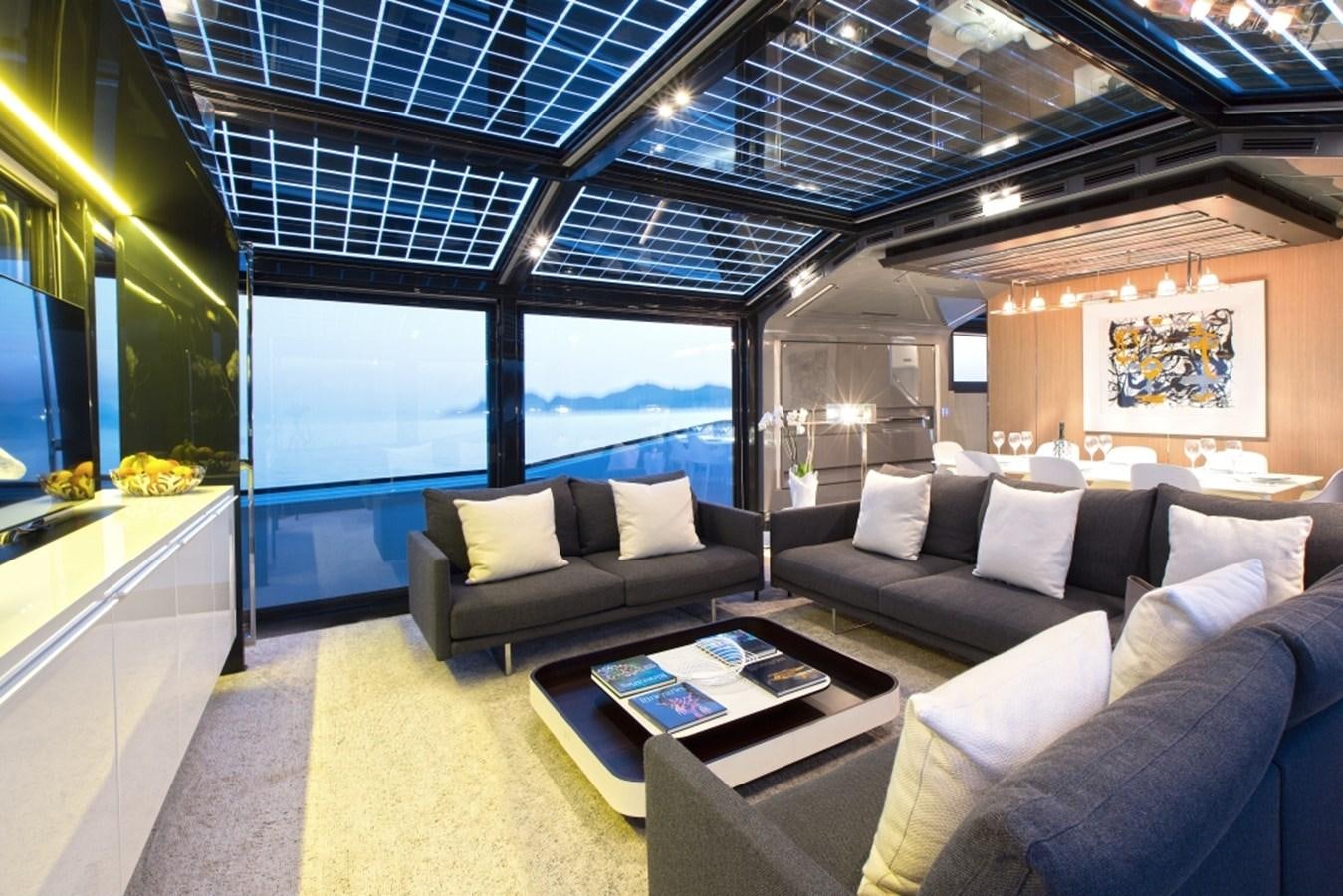 a room with a couch and a table aboard PANGEA Yacht for Sale