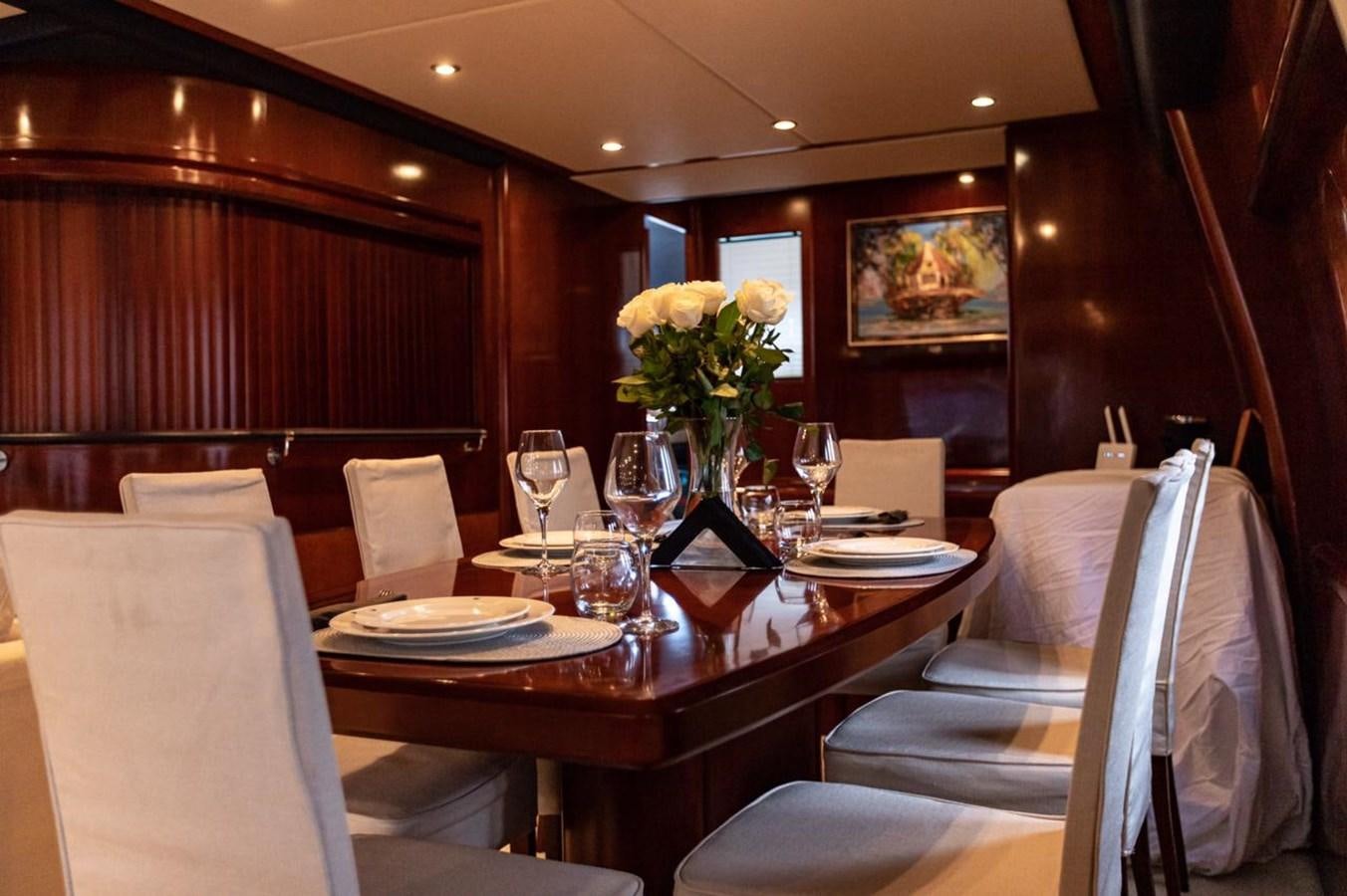 a dining room with a table set aboard PRINCESS 25 M Yacht for Sale