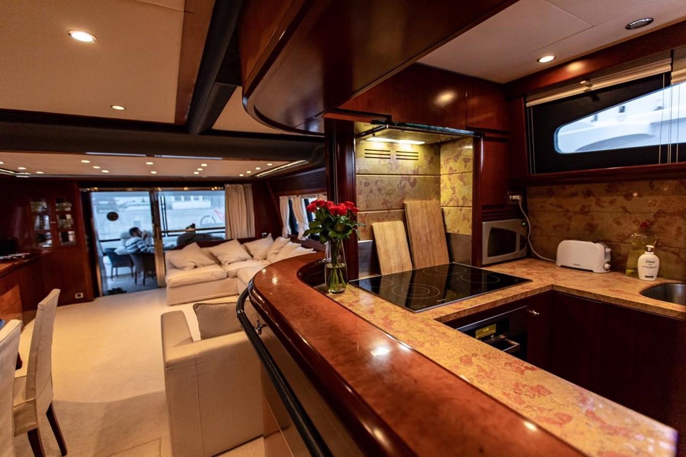 a kitchen with a large island aboard PRINCESS 25 M Yacht for Sale