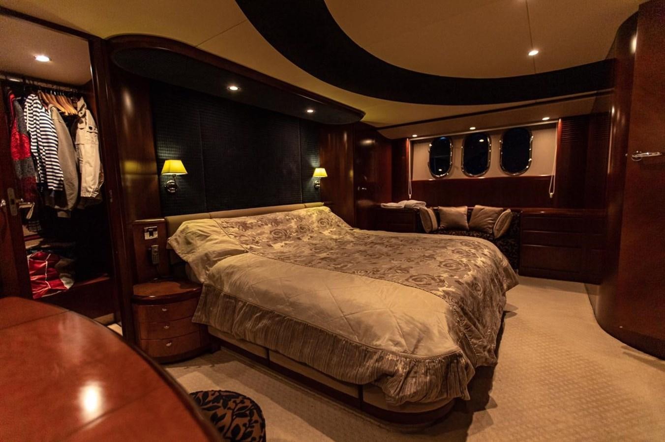 a bedroom with a bed and a mirror aboard PRINCESS 25 M Yacht for Sale