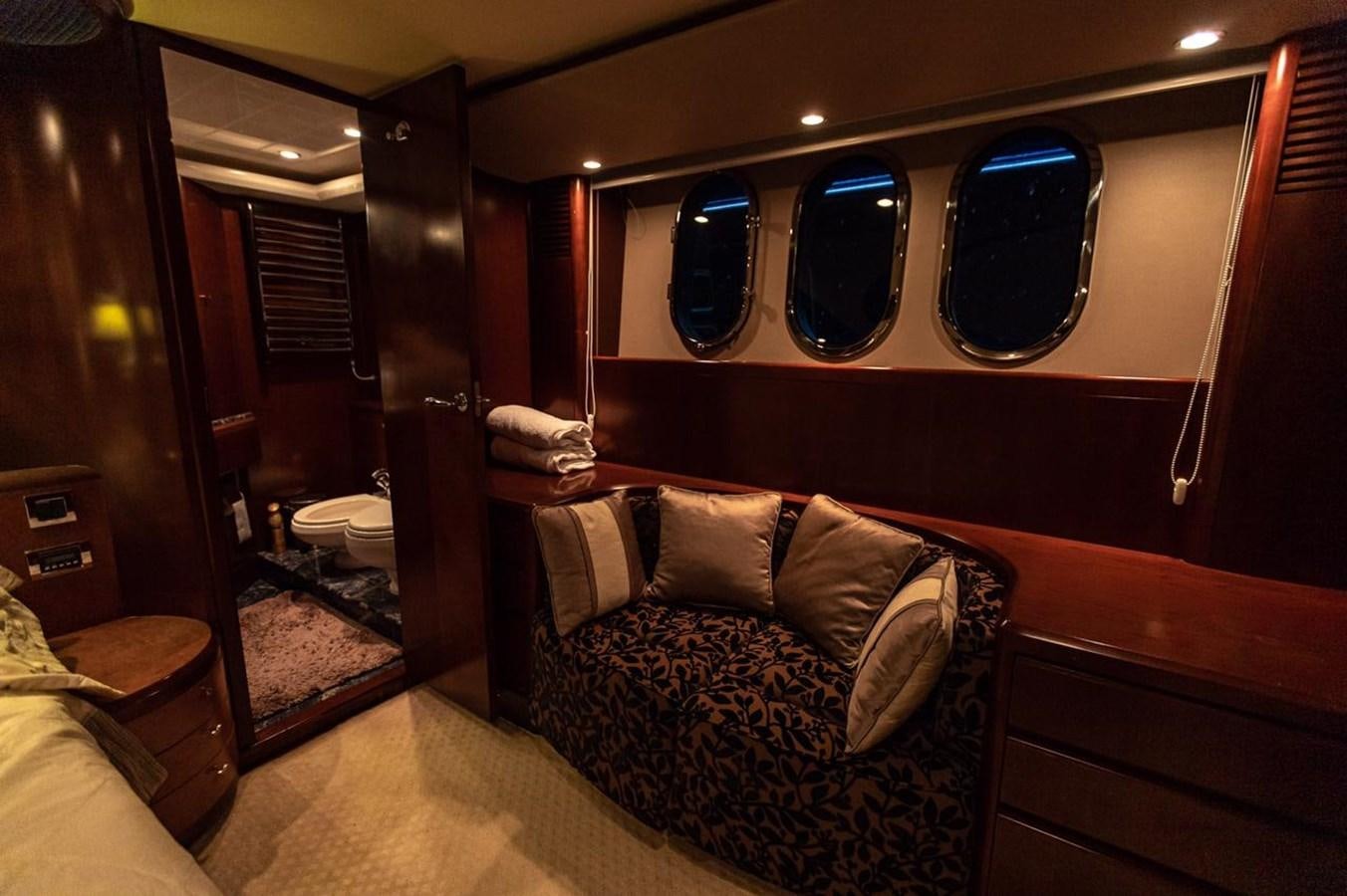 a room with a couch and a mirror aboard PRINCESS 25 M Yacht for Sale