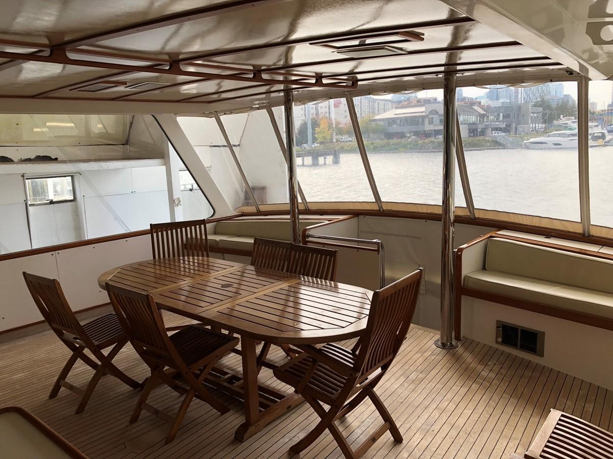 a table and chairs on a boat aboard GOLDEN EAGLE Yacht for Sale