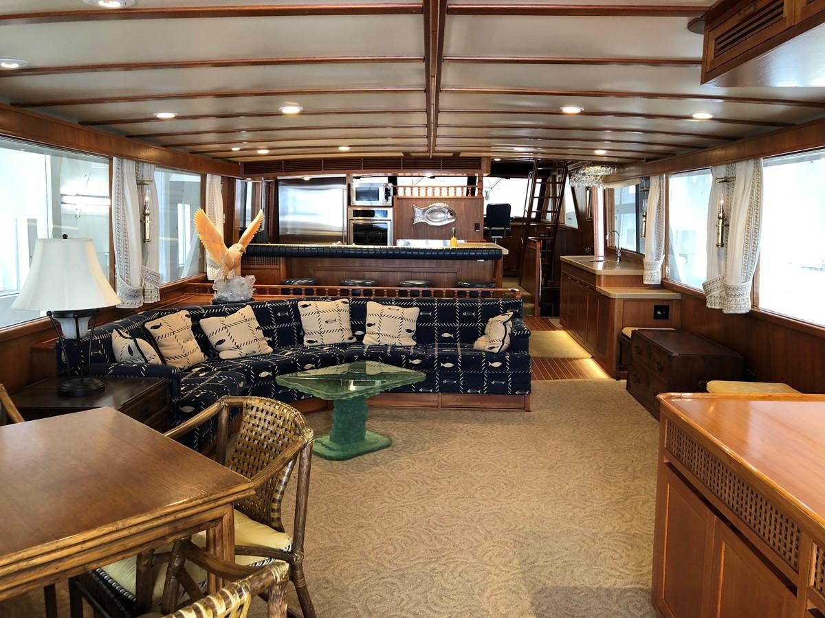 a living room with a large screen aboard GOLDEN EAGLE Yacht for Sale