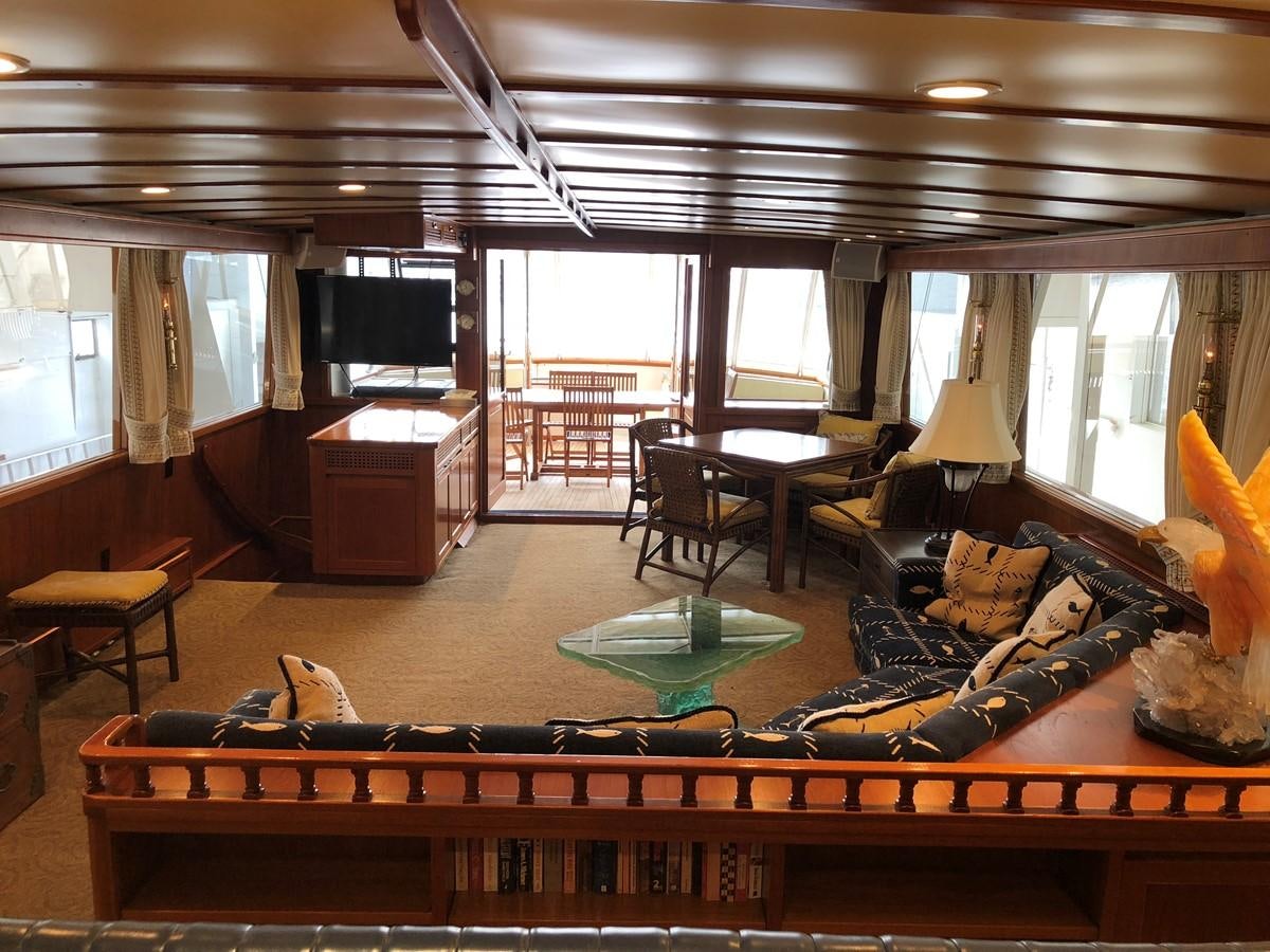 a living room with a large window aboard GOLDEN EAGLE Yacht for Sale