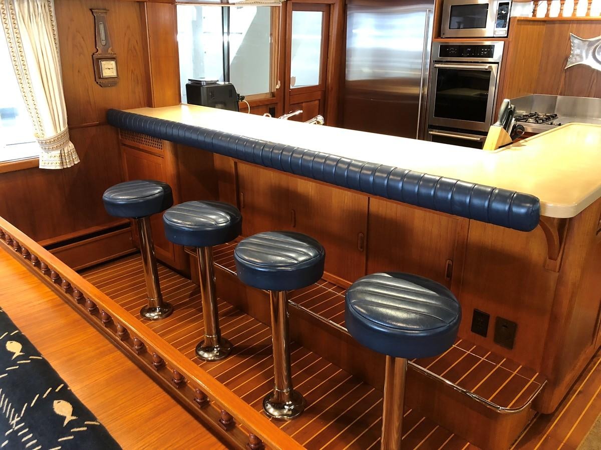 a bar with stools and stools aboard GOLDEN EAGLE Yacht for Sale