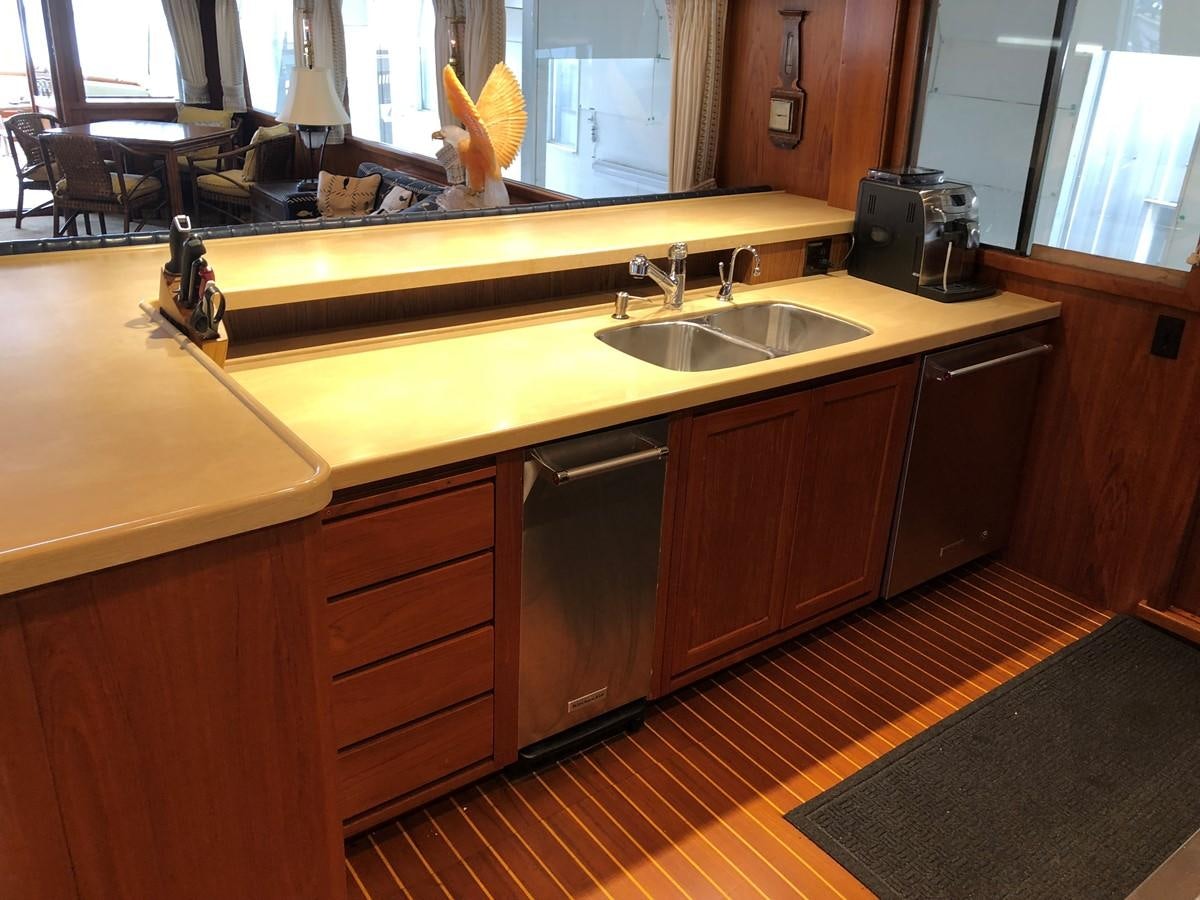 a kitchen with a countertop sink and cabinets aboard GOLDEN EAGLE Yacht for Sale