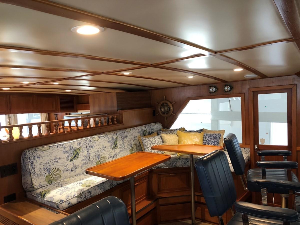 a room with a couch and a table aboard GOLDEN EAGLE Yacht for Sale