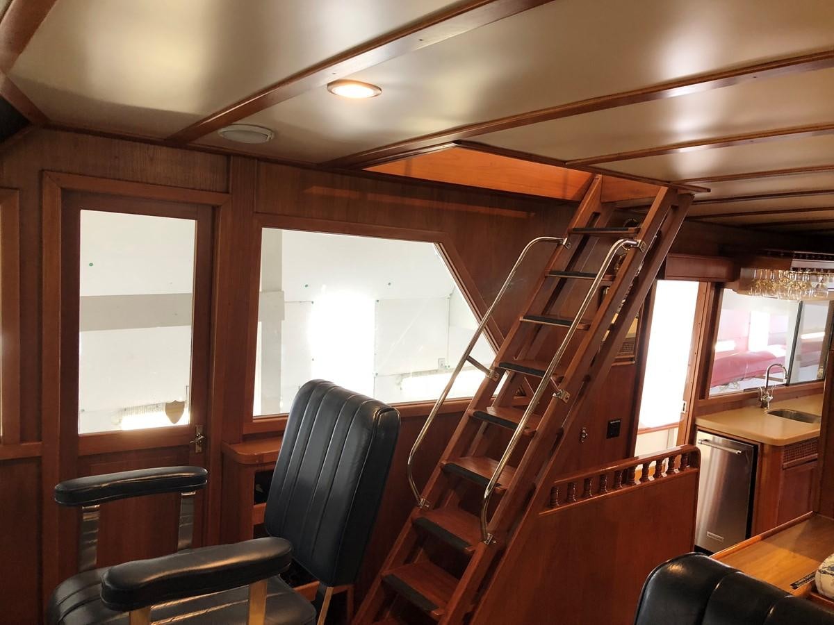 a wooden staircase in a building aboard GOLDEN EAGLE Yacht for Sale