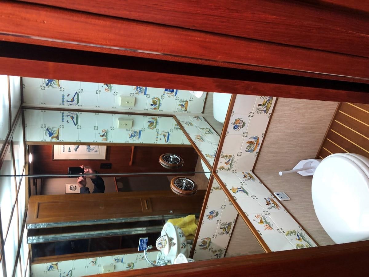 a person standing on a shelf aboard GOLDEN EAGLE Yacht for Sale