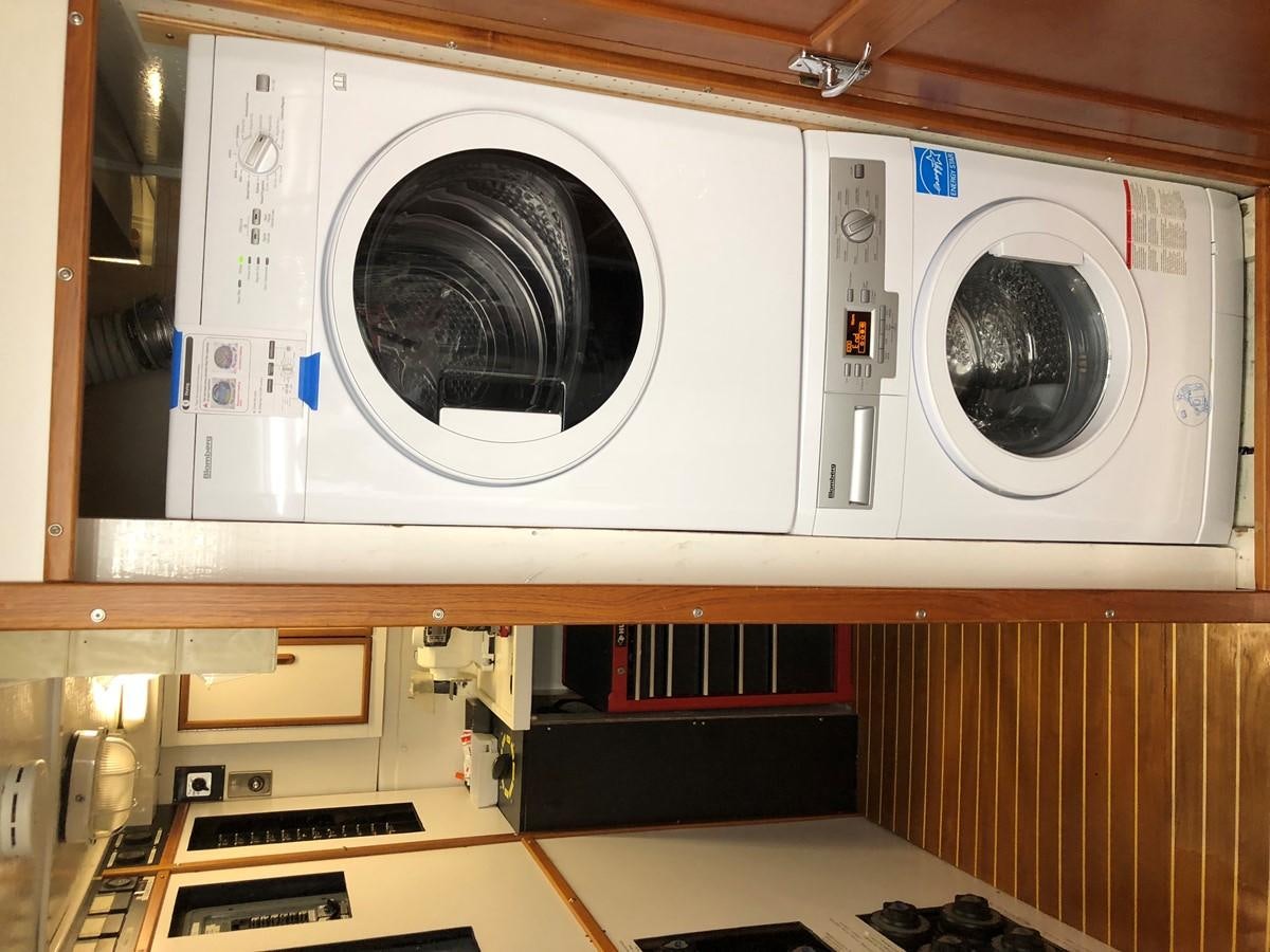 a white washing machine aboard GOLDEN EAGLE Yacht for Sale