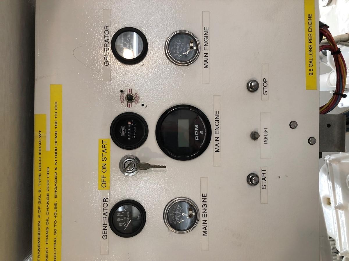 a white electrical box with black knobs and a yellow tape aboard GOLDEN EAGLE Yacht for Sale