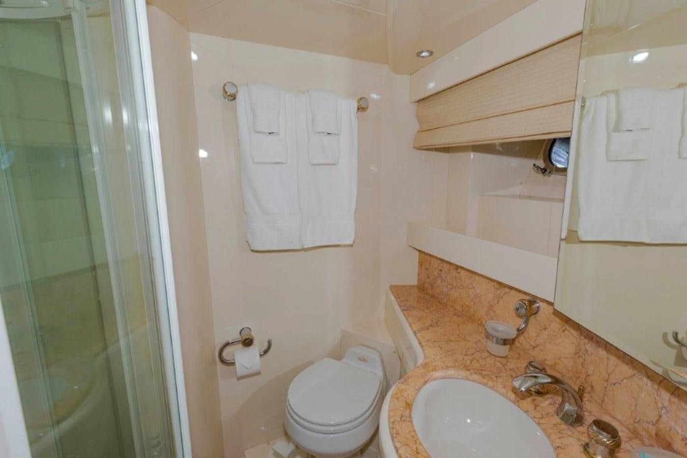 a bathroom with a toilet and a sink aboard DAY DREAMIN' Yacht for Sale