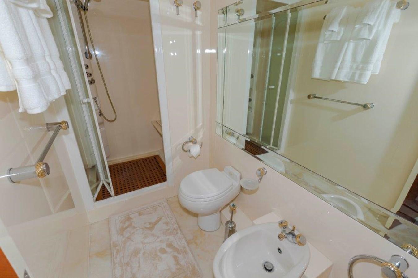 a bathroom with a sink toilet and shower aboard DAY DREAMIN' Yacht for Sale