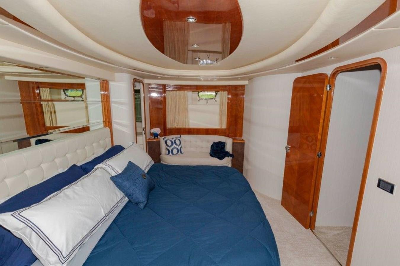 a room with a bed and a mirror aboard DAY DREAMIN' Yacht for Sale