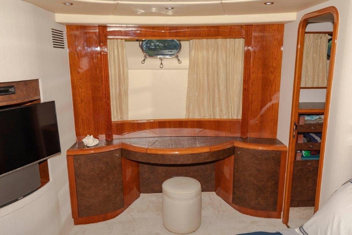 a room with a toilet and a wood cabinet aboard DAY DREAMIN' Yacht for Sale