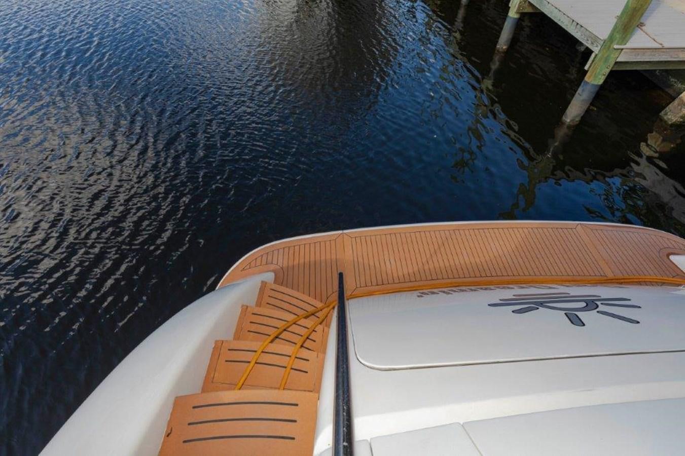 a white boat with a wooden dock aboard DAY DREAMIN' Yacht for Sale