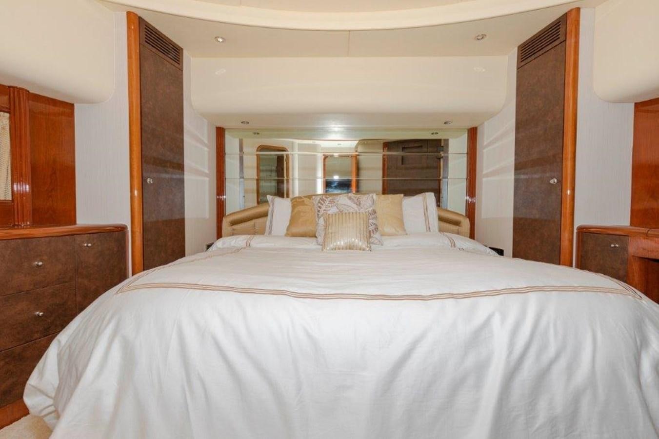 a large bed with white sheets aboard DAY DREAMIN' Yacht for Sale