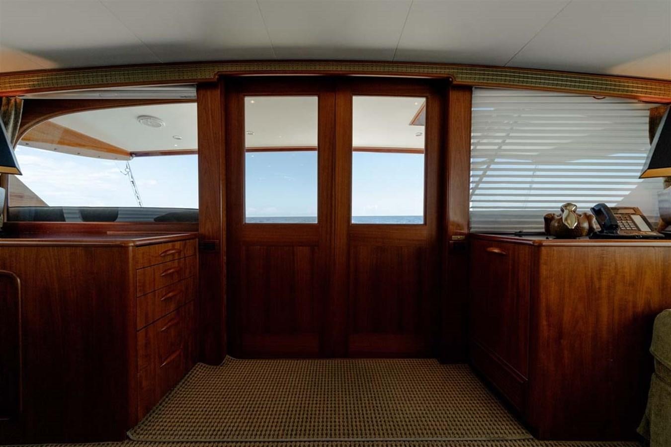 a room with a wood door and a rug aboard SILKY Yacht for Sale