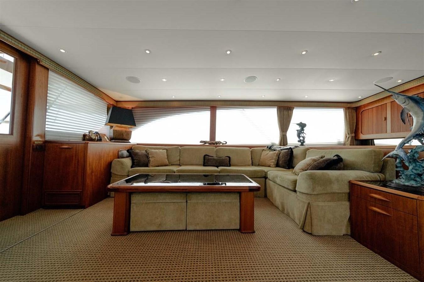a living room with a couch and a coffee table aboard SILKY Yacht for Sale