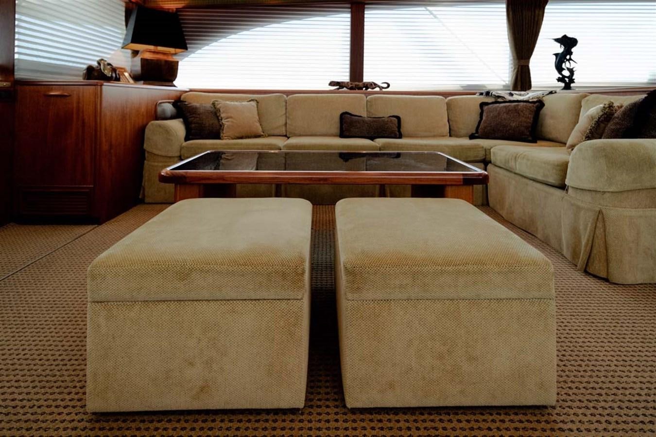 a living room with a couch and a coffee table aboard SILKY Yacht for Sale