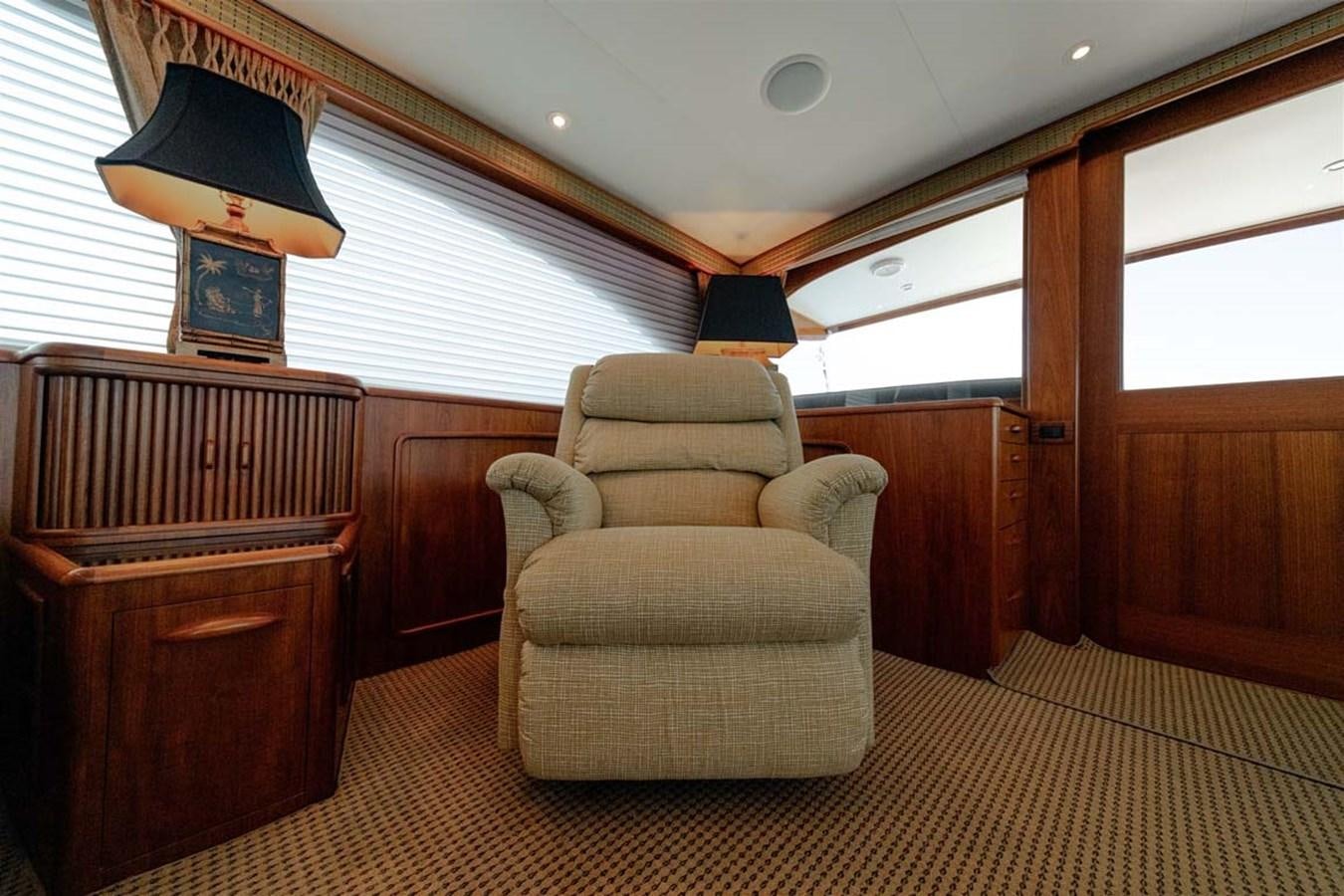 a room with a chair and a dresser aboard SILKY Yacht for Sale