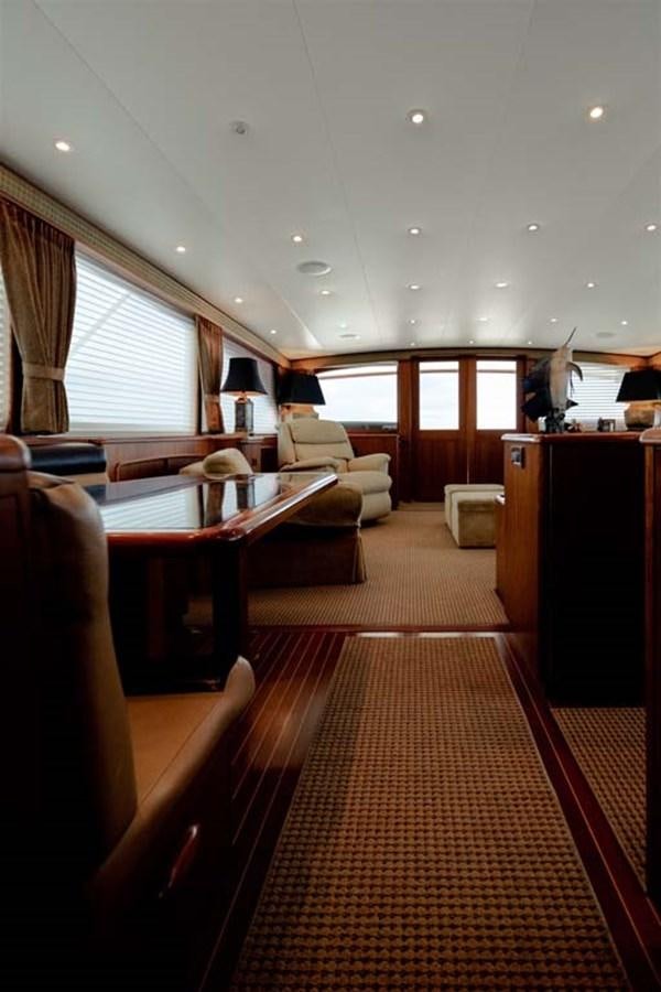a room with a table and chairs aboard SILKY Yacht for Sale
