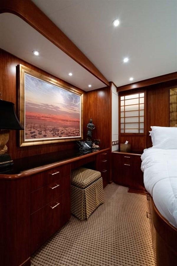 a bedroom with a mirror and a bed aboard SILKY Yacht for Sale