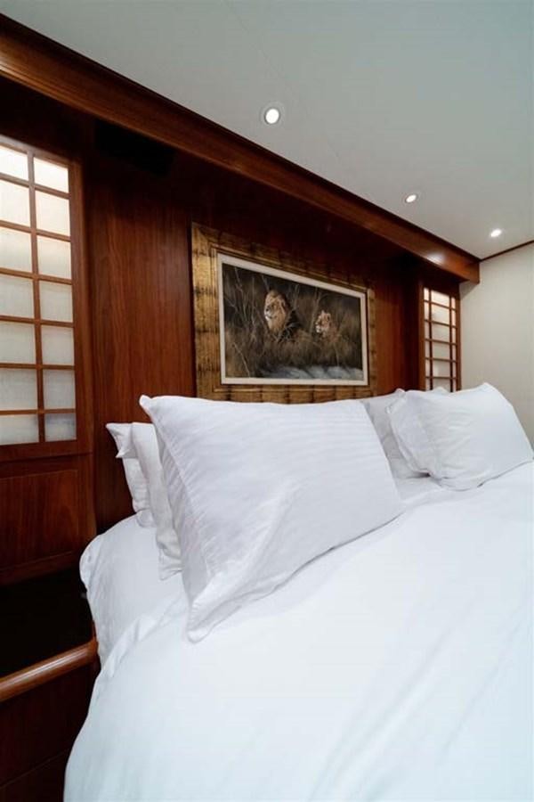 a bed with white sheets aboard SILKY Yacht for Sale