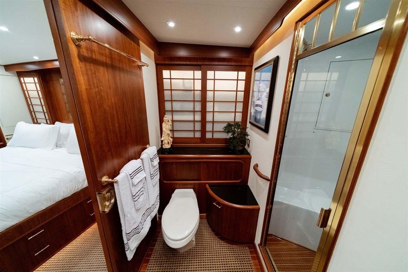 a room with a bed and a chair aboard SILKY Yacht for Sale