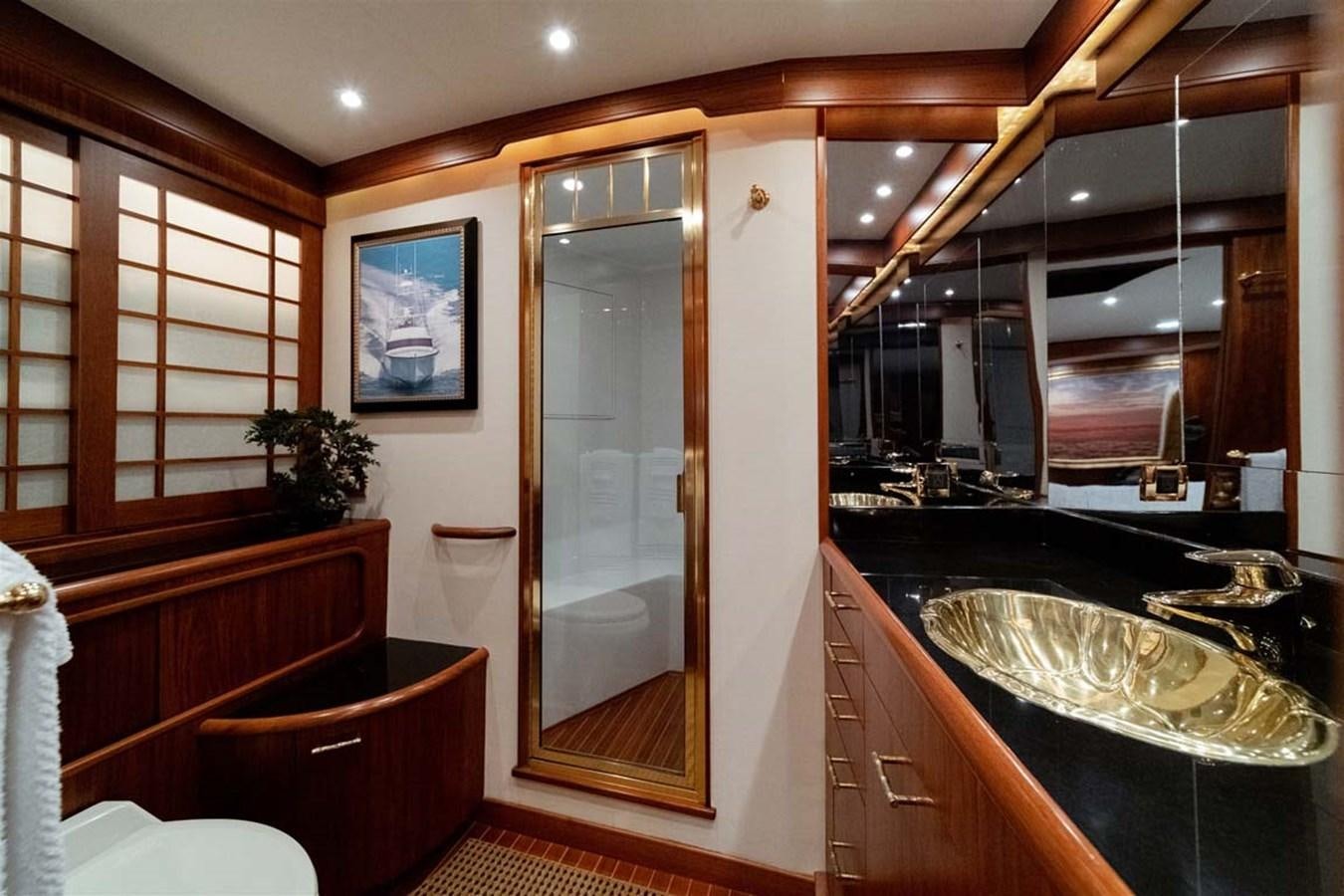 a bathroom with a large glass shower aboard SILKY Yacht for Sale