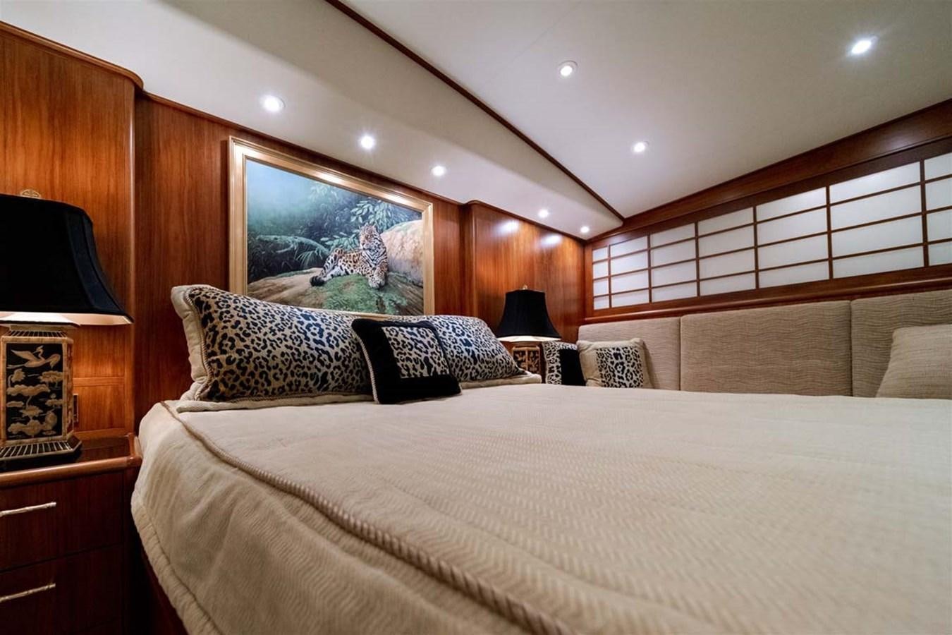 a bed with pillows and a television aboard SILKY Yacht for Sale