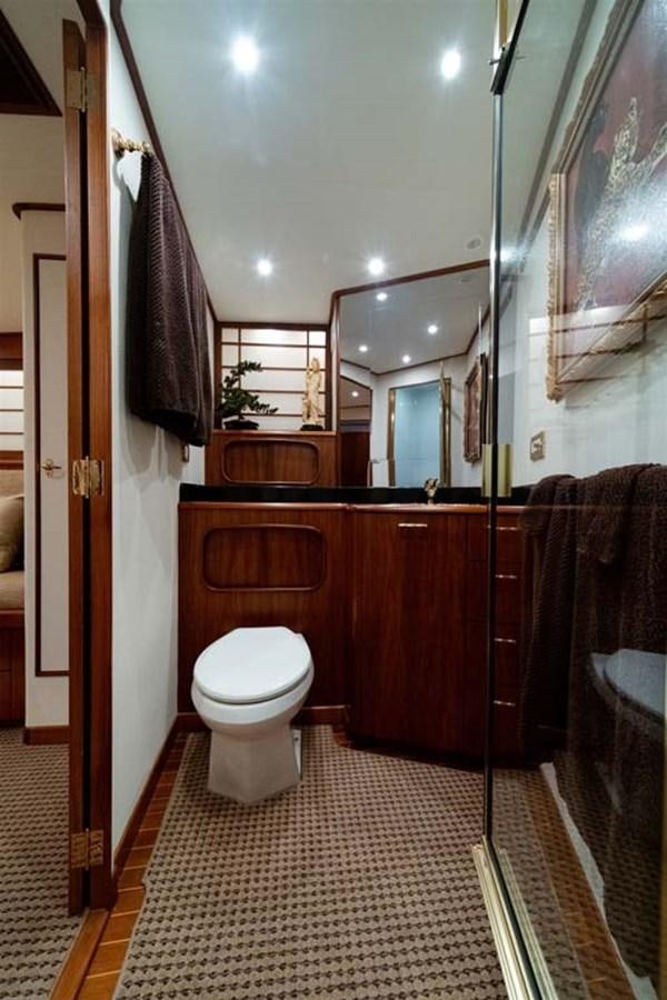 a bathroom with a toilet and a sink aboard SILKY Yacht for Sale