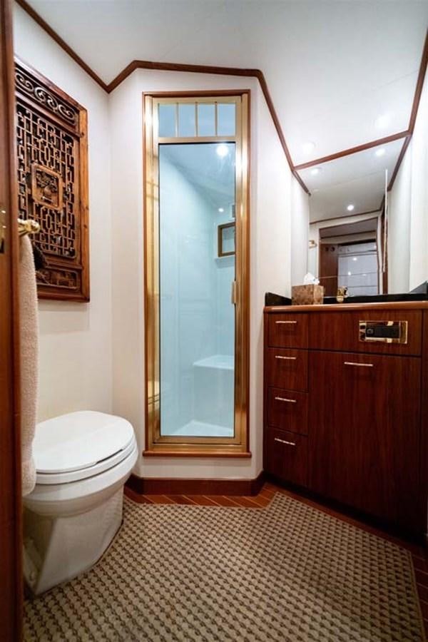 a bathroom with a glass shower door aboard SILKY Yacht for Sale