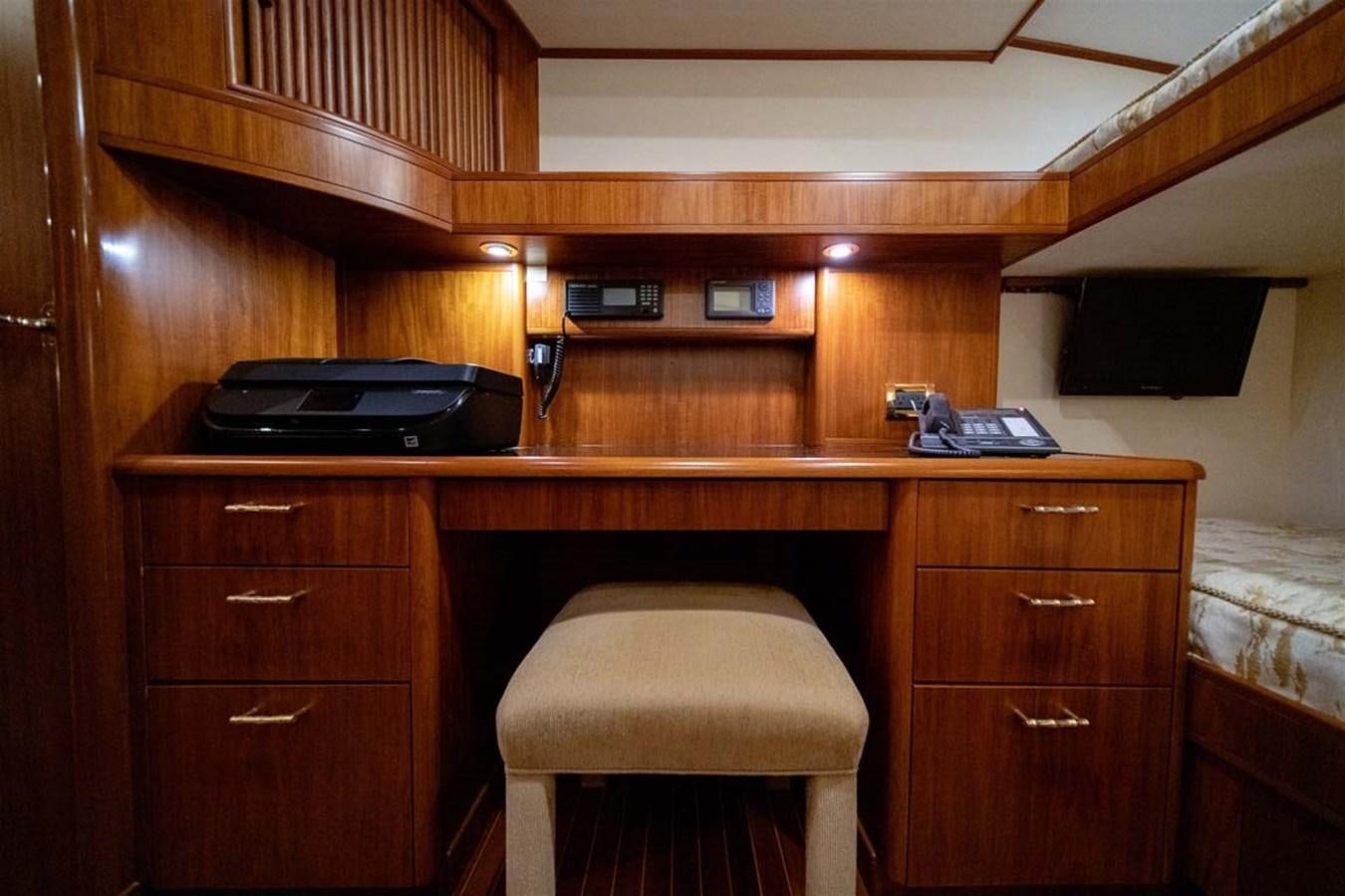 a desk with a computer and a printer on it aboard SILKY Yacht for Sale