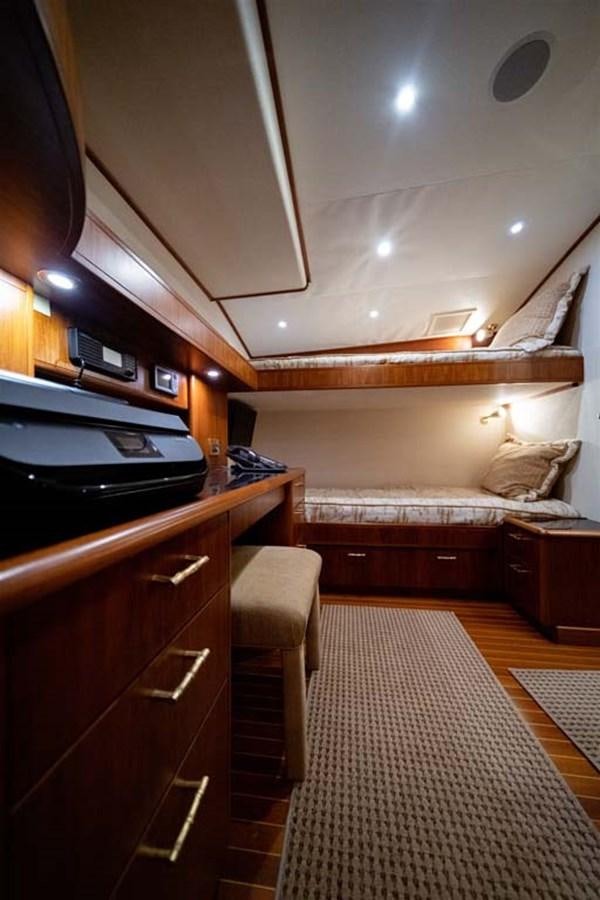 a kitchen with a bed and a microwave aboard SILKY Yacht for Sale