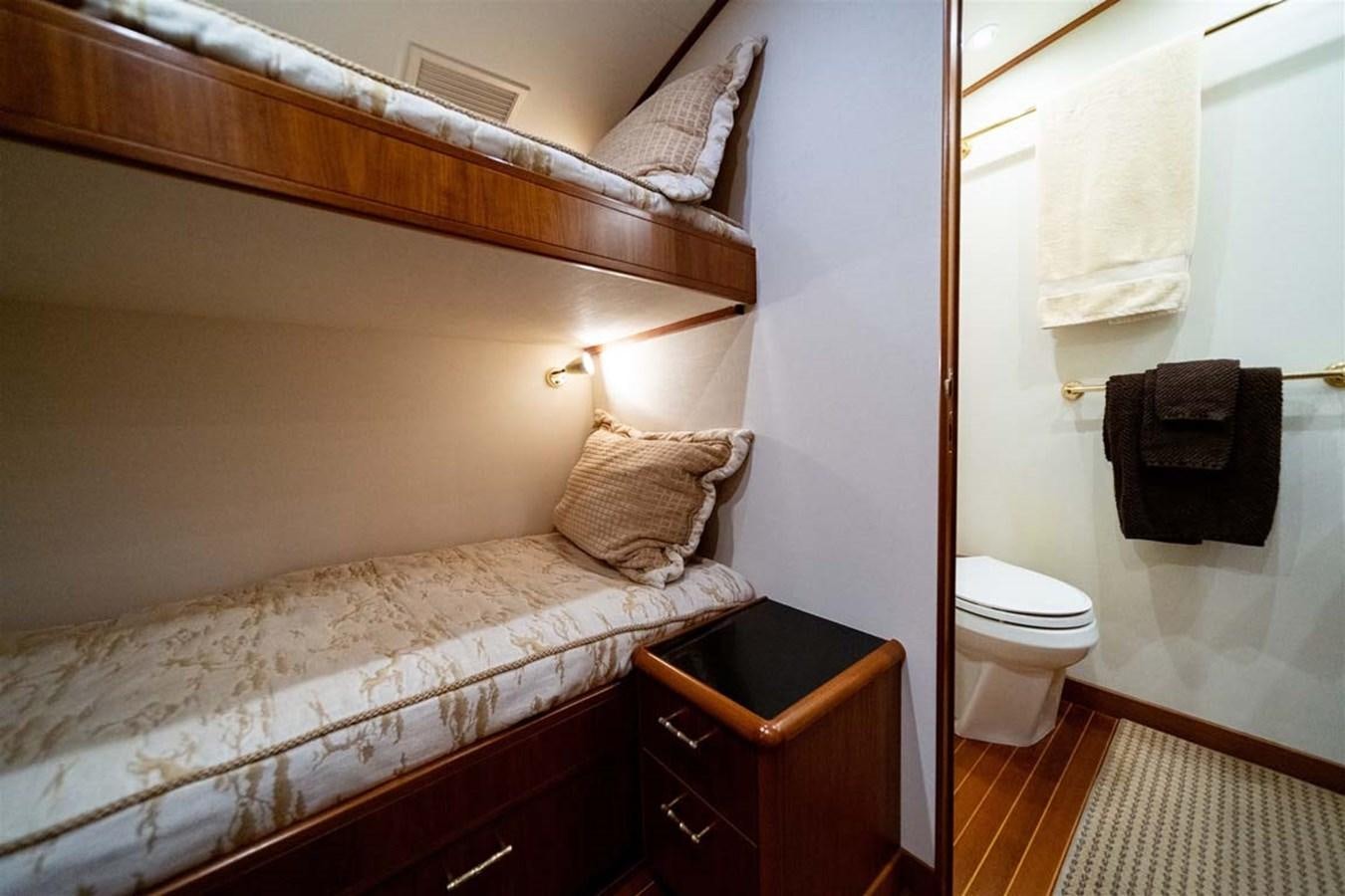 a bathroom with a bed and a vanity aboard SILKY Yacht for Sale