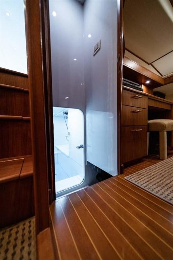 a room with a wood floor and a mirror aboard SILKY Yacht for Sale