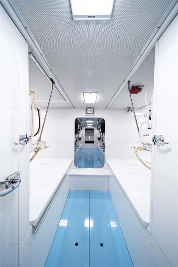 a long hallway with a light on the ceiling aboard SILKY Yacht for Sale