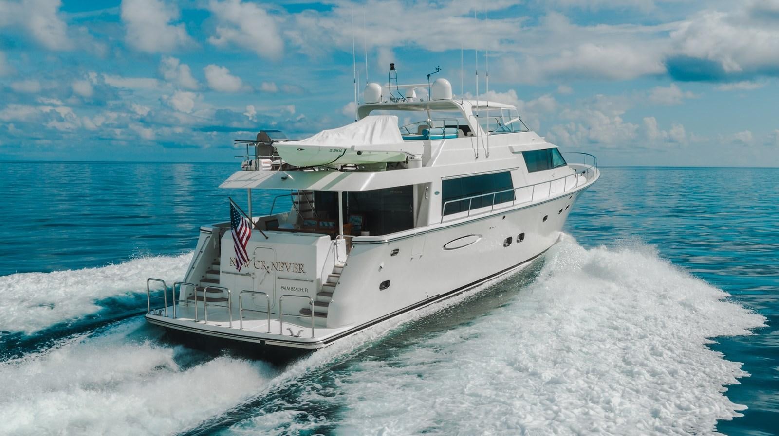a boat on the water aboard NOW OR NEVER Yacht for Sale