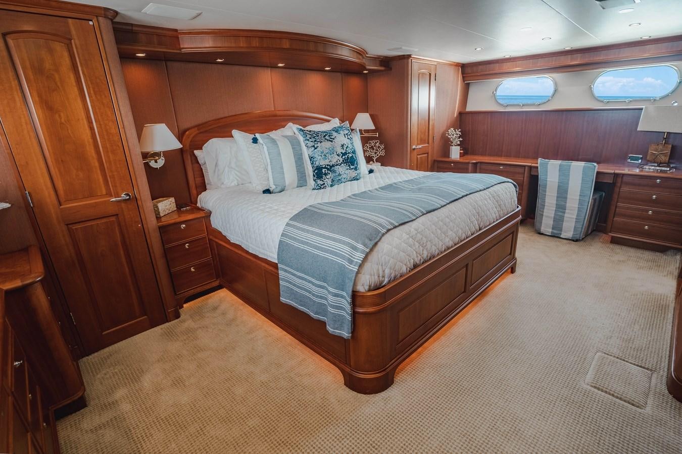 a bed in a room aboard NOW OR NEVER Yacht for Sale