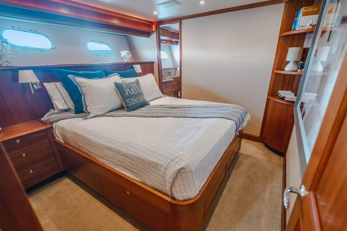 a bed in a room aboard NOW OR NEVER Yacht for Sale