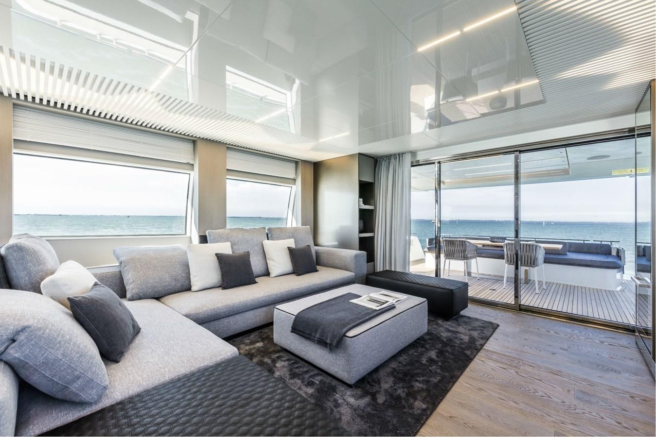 a living room with a large window aboard FERRETTI YACHTS 850 HT  Yacht for Sale