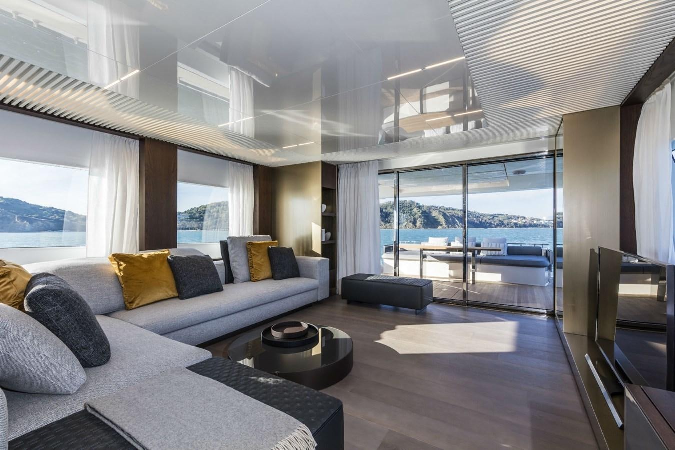 a large living room with a large window aboard FERRETTI YACHTS 850 HT  Yacht for Sale