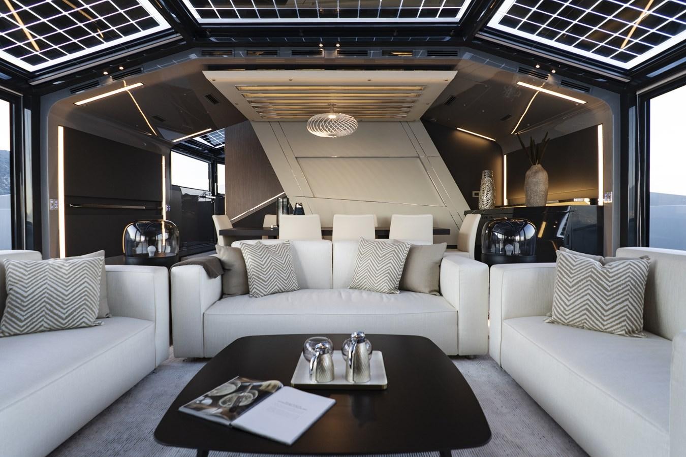 a living room with a couch and a coffee table aboard ARCADIA A85 Yacht for Sale
