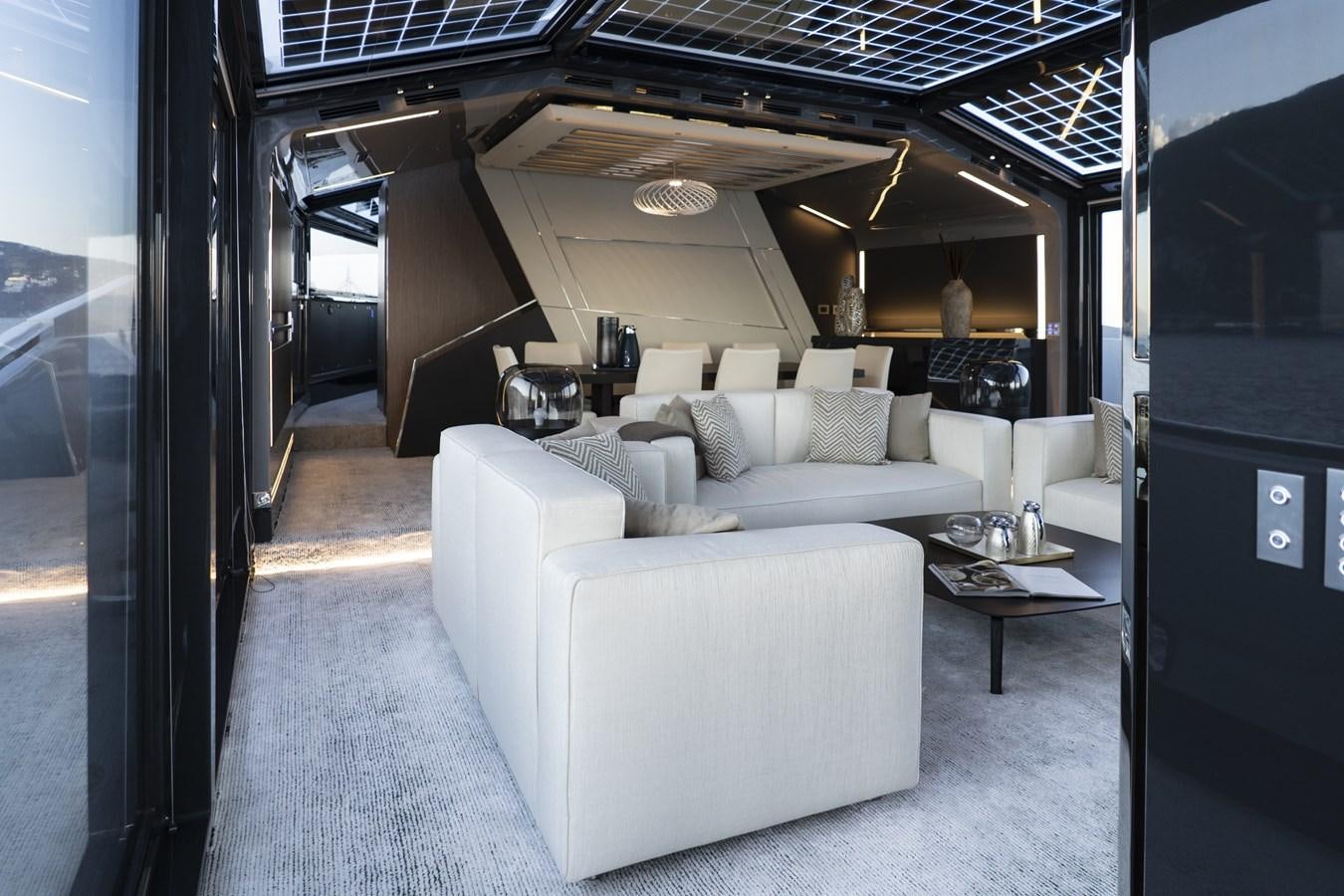 a living room with a couch aboard ARCADIA A85 Yacht for Sale