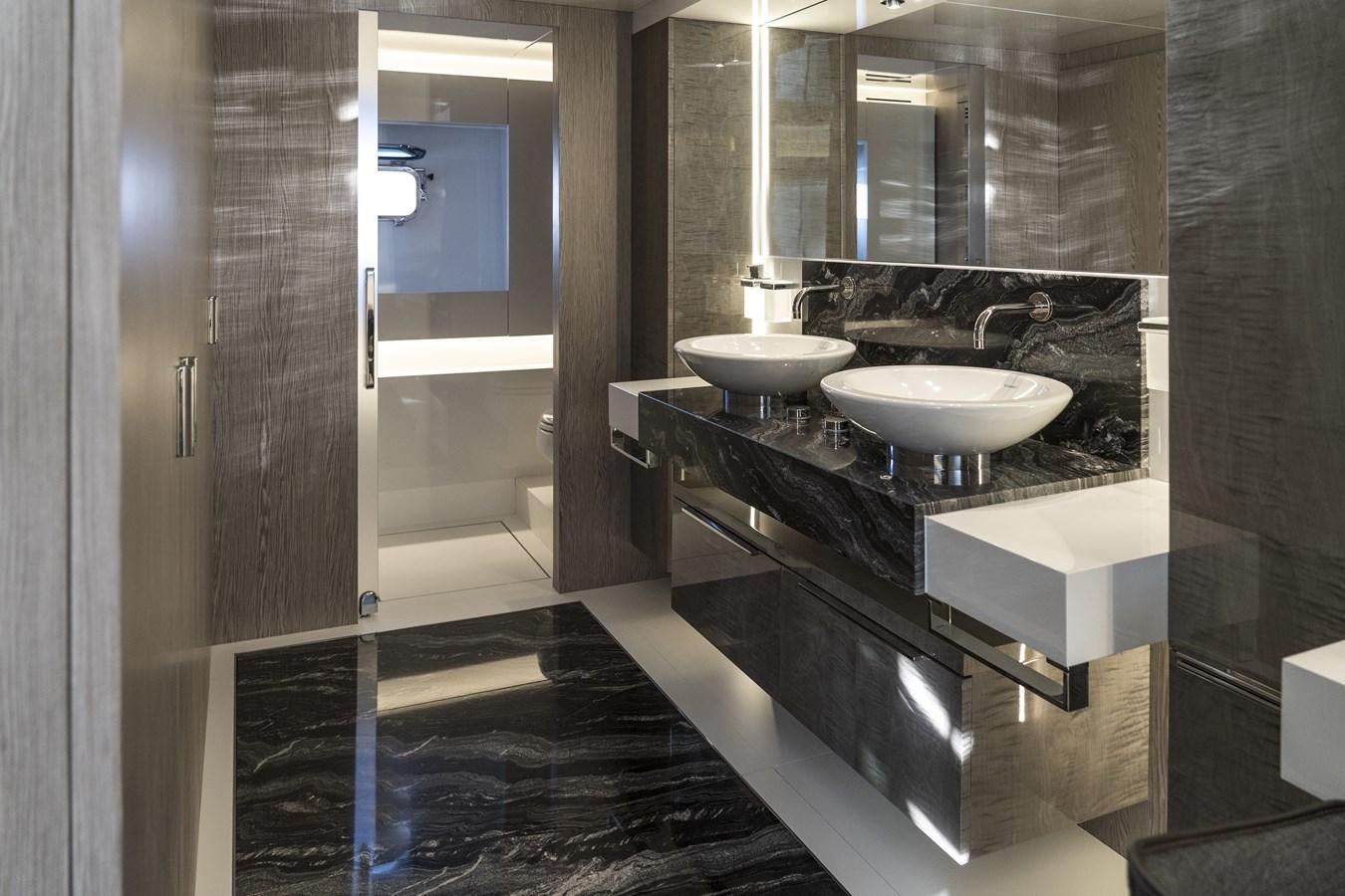 a bathroom with sinks and mirrors aboard ARCADIA A85 Yacht for Sale