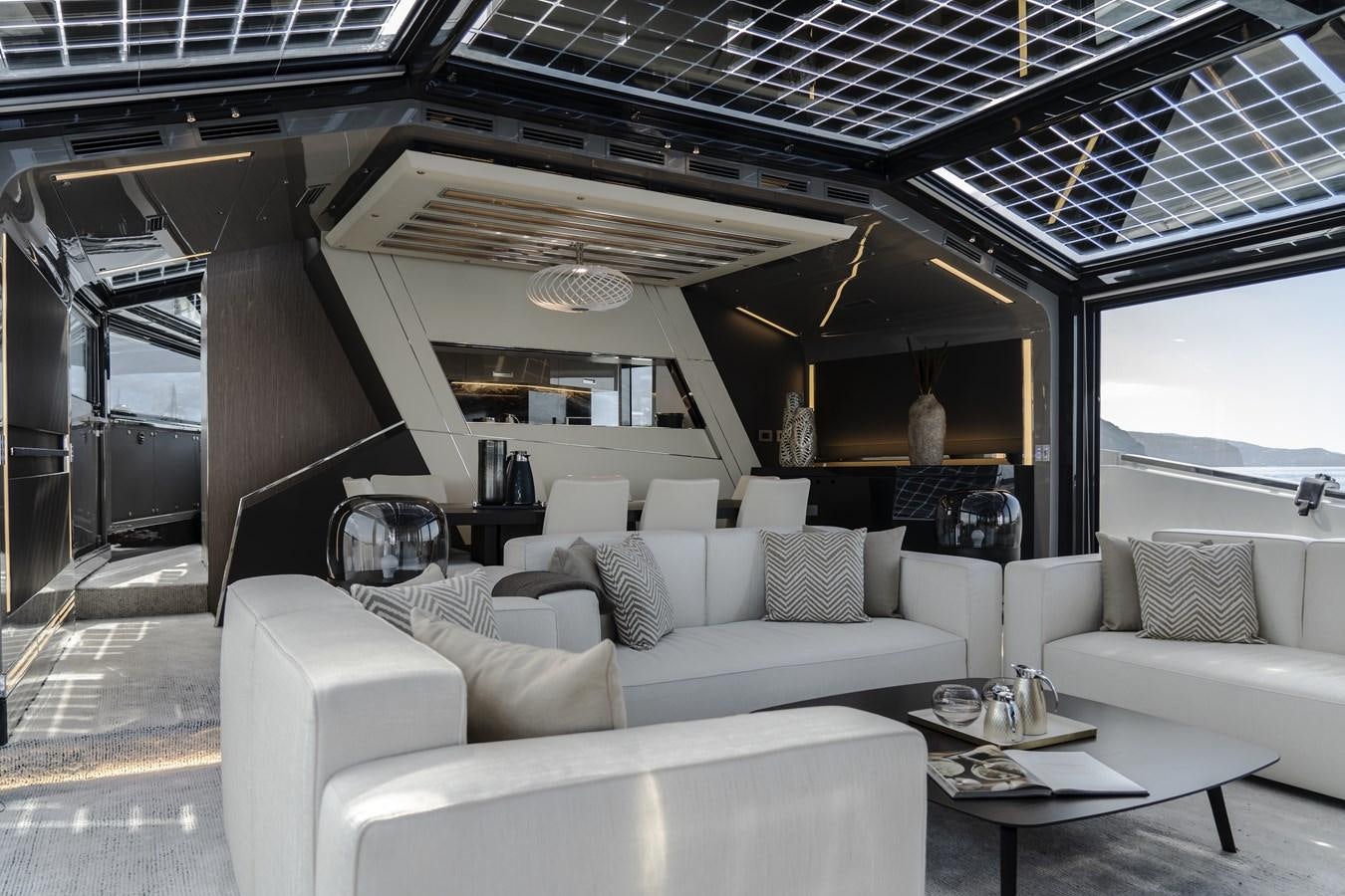 a room with a couch and a table aboard ARCADIA A85 Yacht for Sale